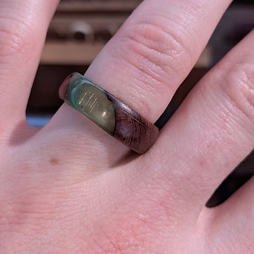 Moss green resin poured diagonally through the band.