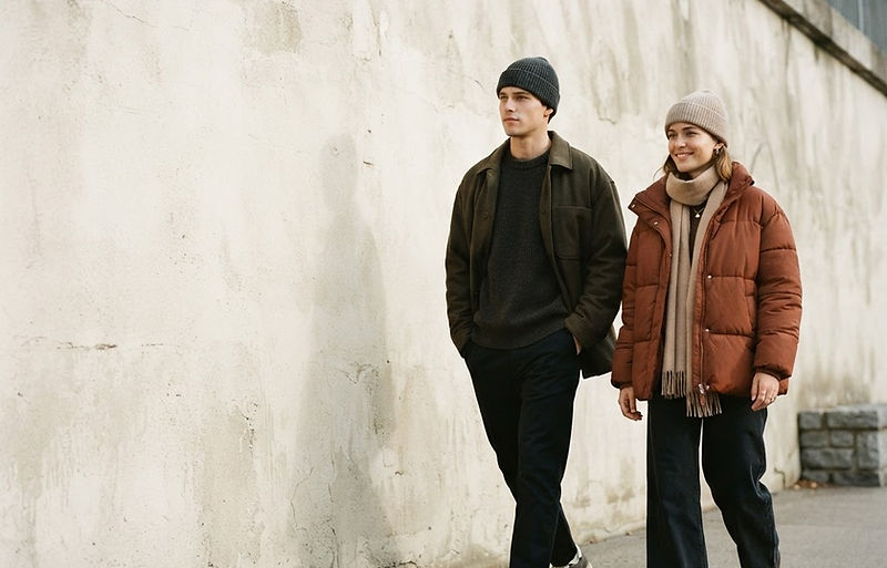 Two people wearing BRIM knit beanies