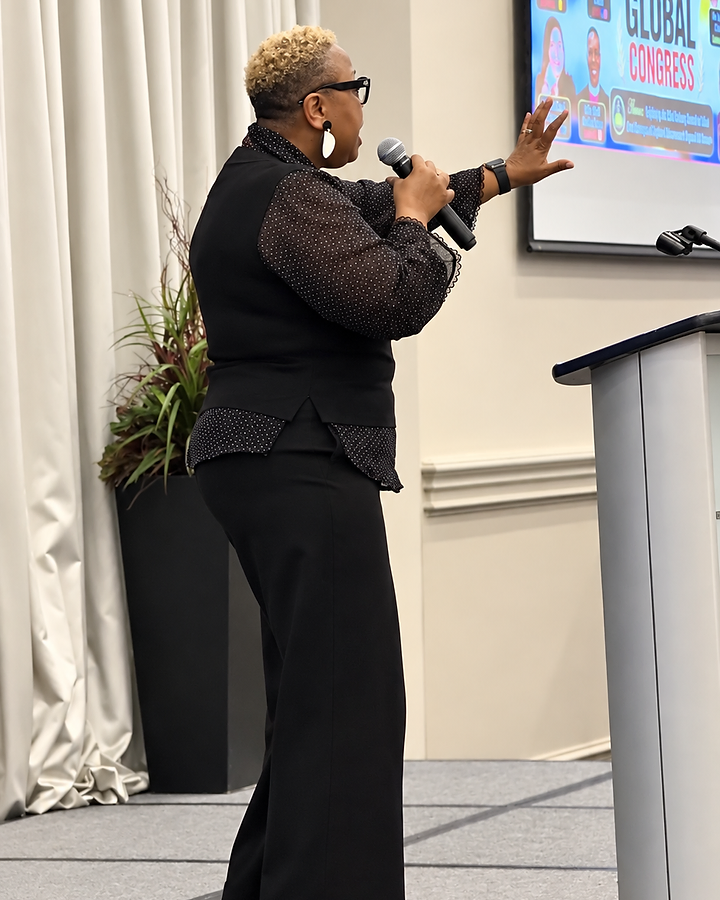 Dr. Maricia Sherman speaking on stage