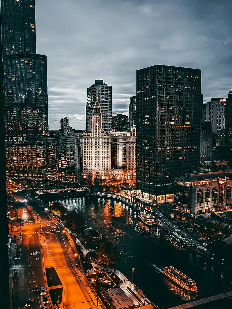 A city skyline along a river at dusk (stock photograph)