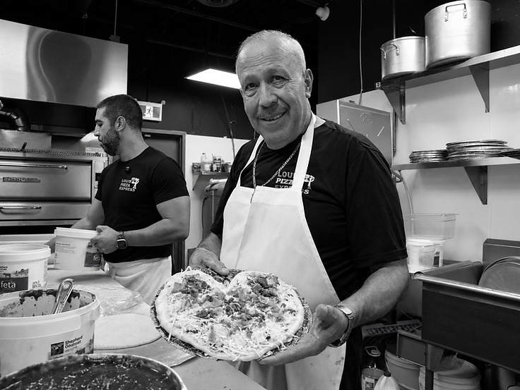 The owner of Louis Pizza Express in his kitchen in Orleans, Ottawa