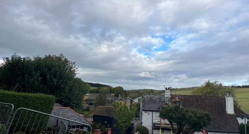 View over rooftops of Lydden village towards countryside surrounding The Lydden Bell Lodge