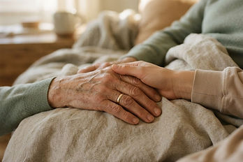 A younger hand holding an older hand