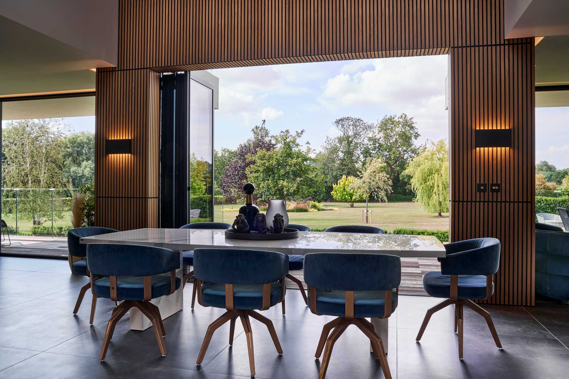 A dining room that opens to the lawn