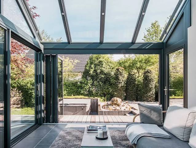 Under a glass roof, out to the deck
