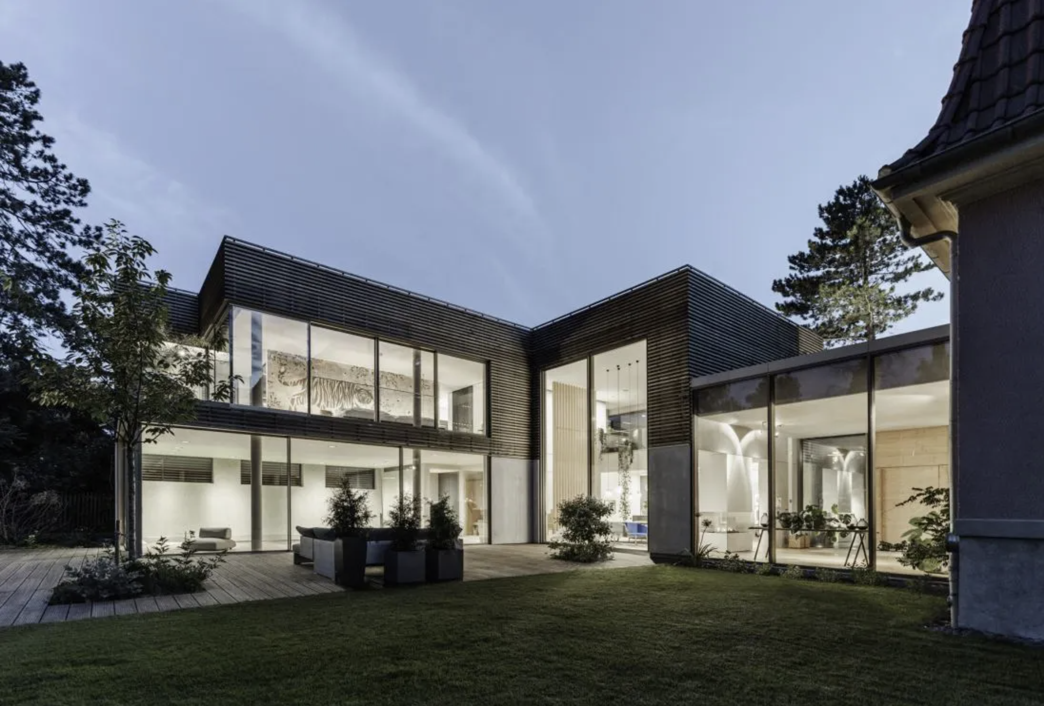 Solarlux sliding doors opening a kitchen onto a garden terrace