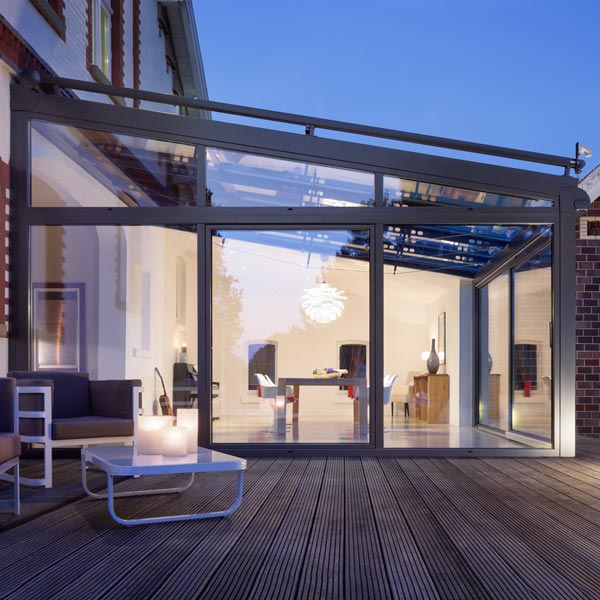 A glazed terrace at dusk