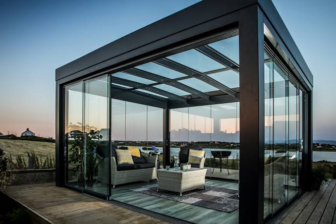 A glass pavilion by the water