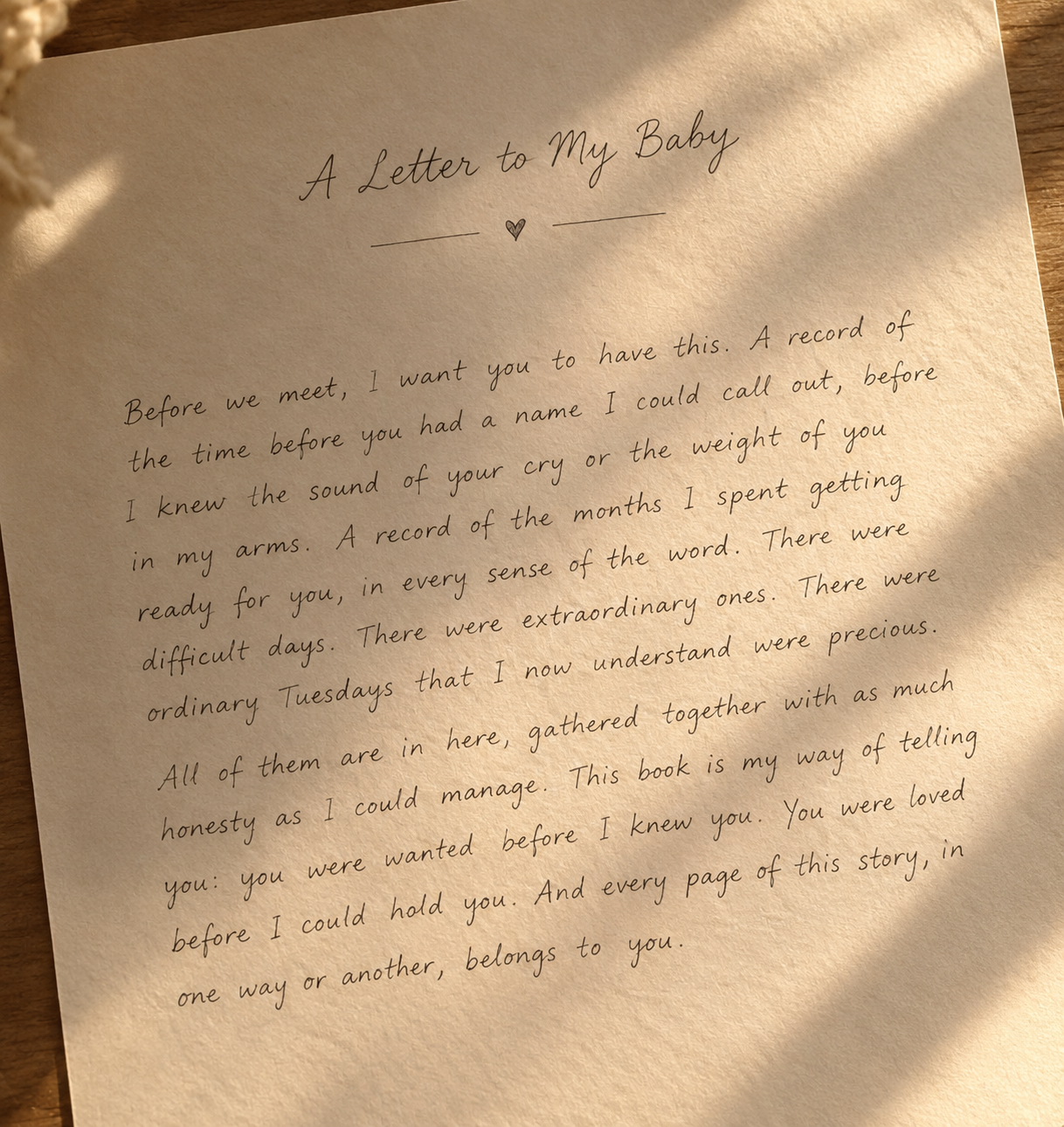 A handwritten-style letter to my baby printed on textured paper inside the keepsake book