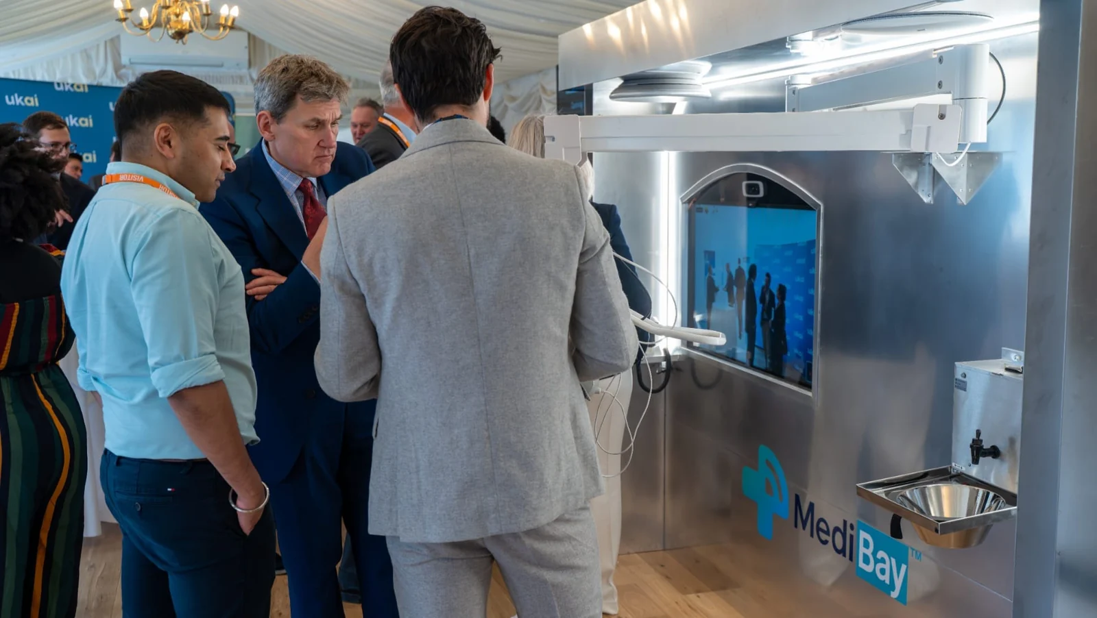 Attendees gathered around the MediBay TechWall during the Houses of Parliament demonstration.