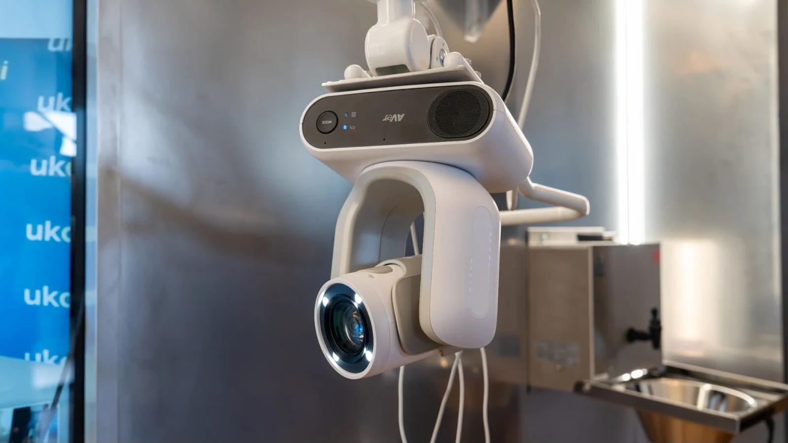 Close-up of the camera mounted on the MediBay TechWall, with its lens and articulated mount visible.