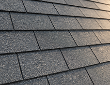 Detail of traditional three-tab asphalt shingles in a uniform flat grid pattern