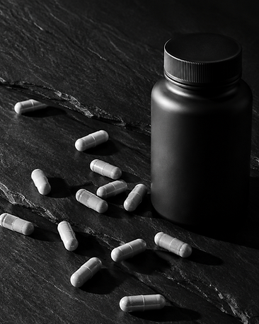 Cortisol Ghost Stress Support Capsules — black and white studio photograph