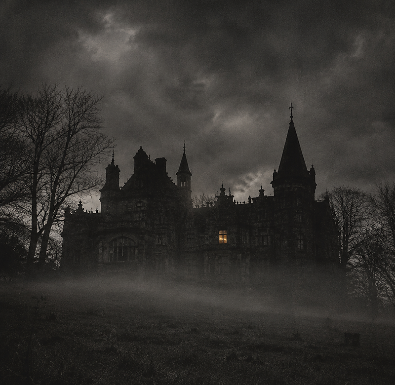 A fog-covered Victorian manor at dusk