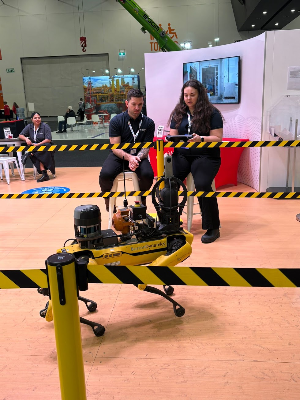 Shane Drumm with a Boston Dynamics robot at a technology conference
