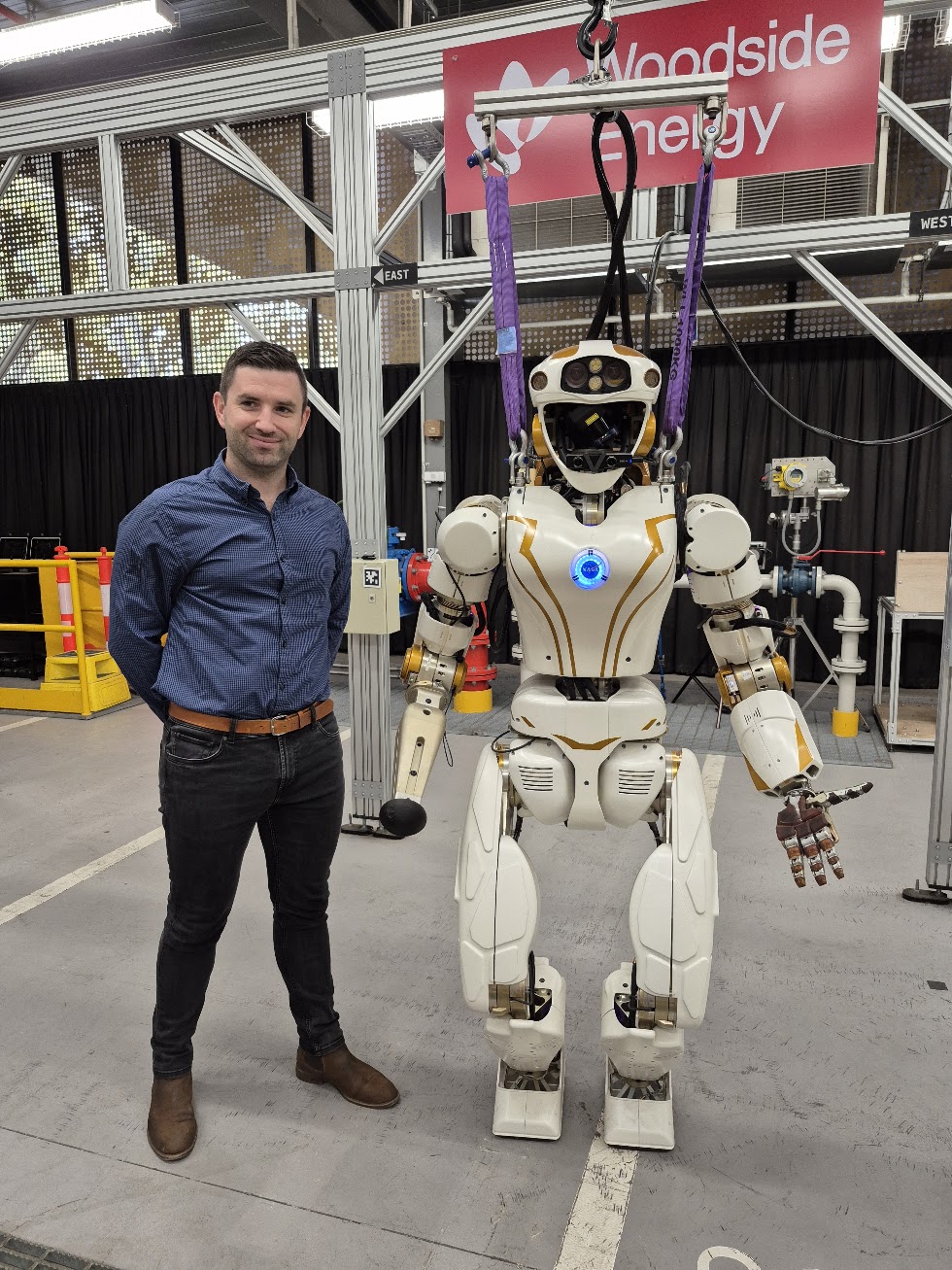 Shane Drumm with a NASA robot at an innovation centre