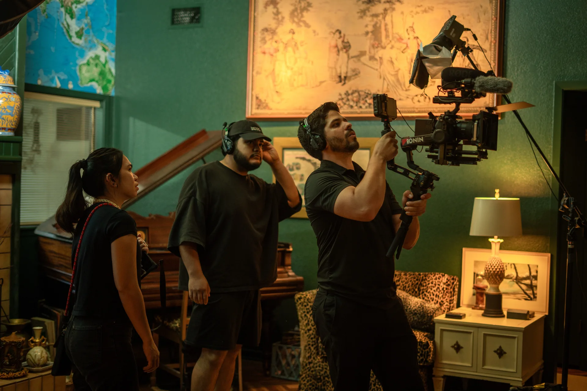 Thunder Media crew preparing a cinema camera and lighting on location.