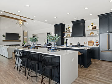 Open-concept kitchen with charcoal cabinetry
