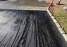 Sealed driveway surface cordoned off after resurfacing