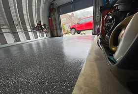 Finished grey flake epoxy floor in a garage