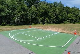 Painted court surface with crisp white boundary and key lines