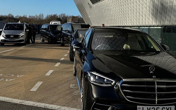 Mercedes-Benz S-Class and fleet vehicles at an airport terminal