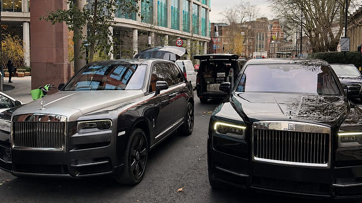 Rolls-Royce Cullinans parked on a London street