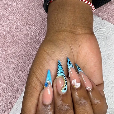 Pointed blue French tips with black stripes and gold details