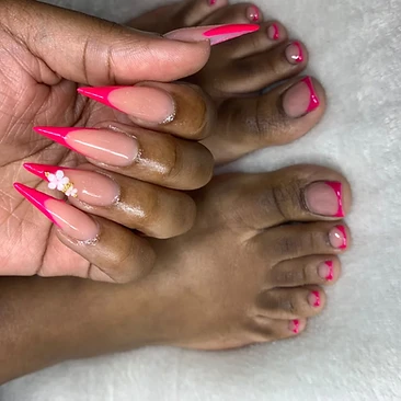 Bright pink French tips with floral accent nails