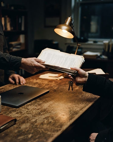 Documents and keys being handed over at a desk