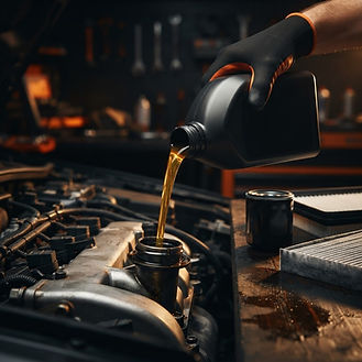 Fresh full synthetic oil being poured in, with new filters ready