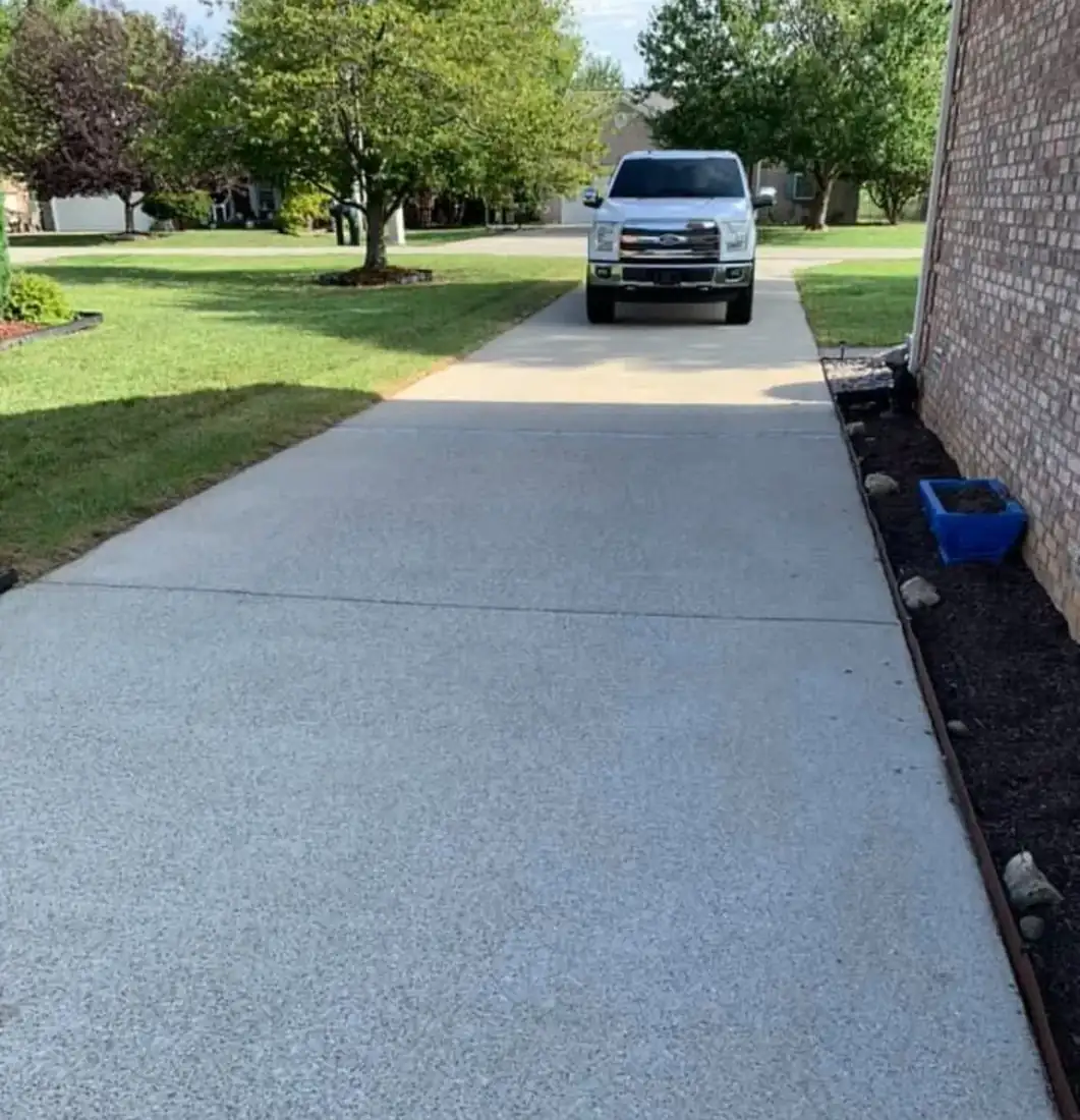 Exposed aggregate driveway after cleaning, bright and clean