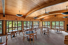 Wood-paneled river-view dining room