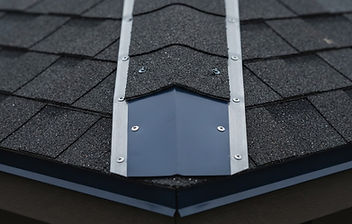 Sealed fortified roof edge detail on a charcoal shingle roof