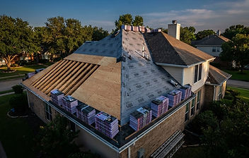 Exposed roof deck with new underlayment during a roof replacement