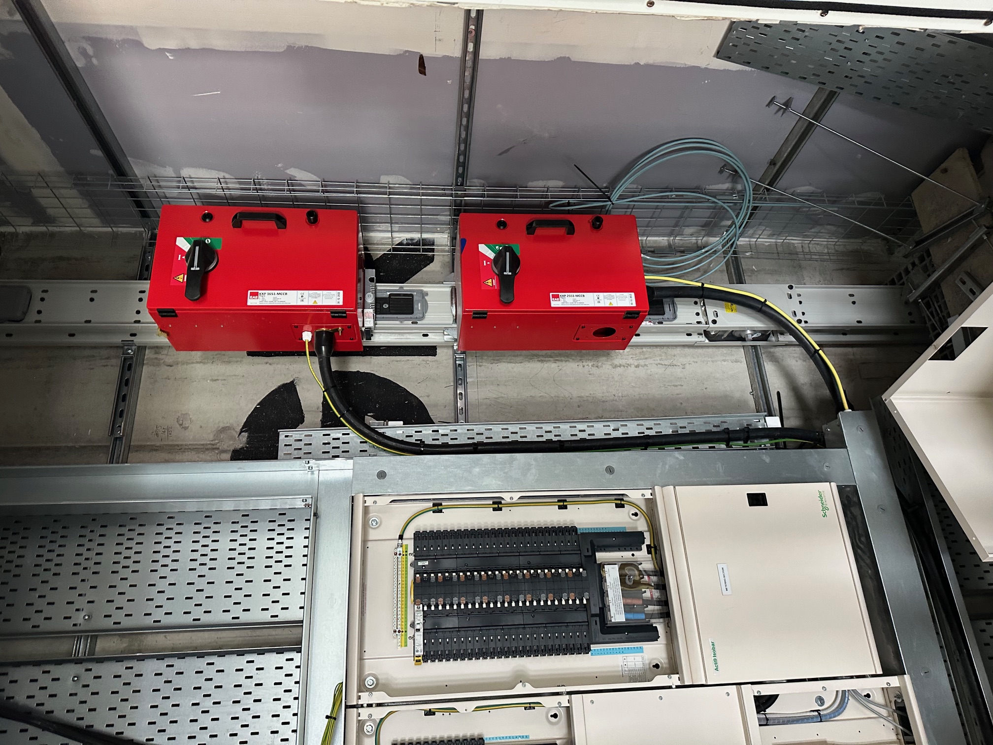 MCCB units and a metered distribution board mounted on cable trunking in a plant area