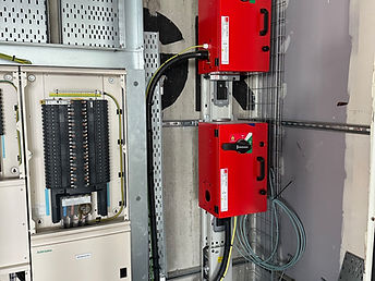 MCCB units and a metered distribution board mounted on cable trunking in a plant area