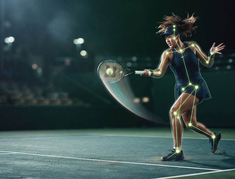 Tennis player mid-forehand with an AI biomechanics skeleton overlay tracking her joints