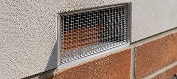 Stainless steel insect mesh fitted over a brick weep hole