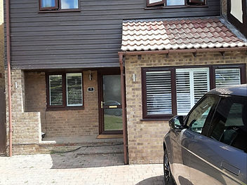 Before: Upper storey re-clad in cream shiplap