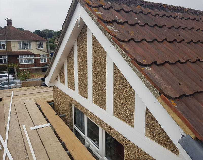 New white cladding and bargeboards fitted up a gable end