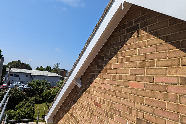 New white bargeboards and soffit fitted along a gable end