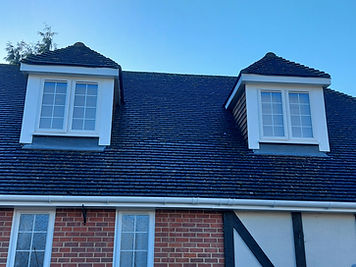 Gutter line across a dormer roof