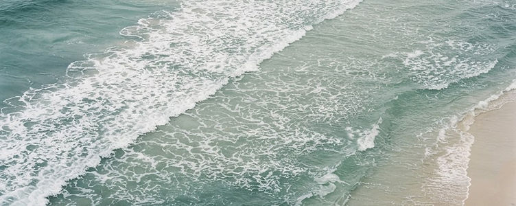 Gentle waves meeting a shallow shoreline