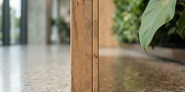 Sustainable building materials and a living wall in a corporate lobby, representing ESG reporting