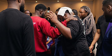 Laying hands in prayer during the service