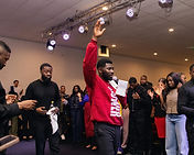 Dr Evans Oppong on stage in a Days of Power hoodie