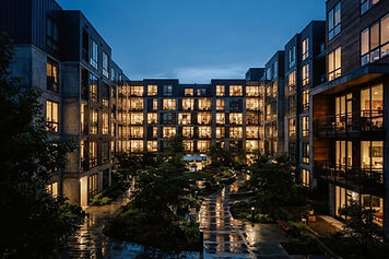 A modern apartment community courtyard at dusk