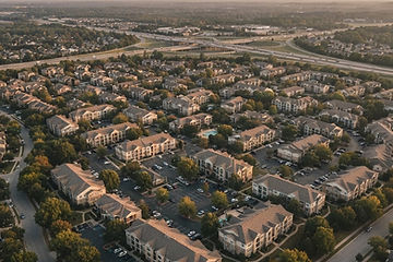 Aerial view of a suburban apartment submarket at golden hour