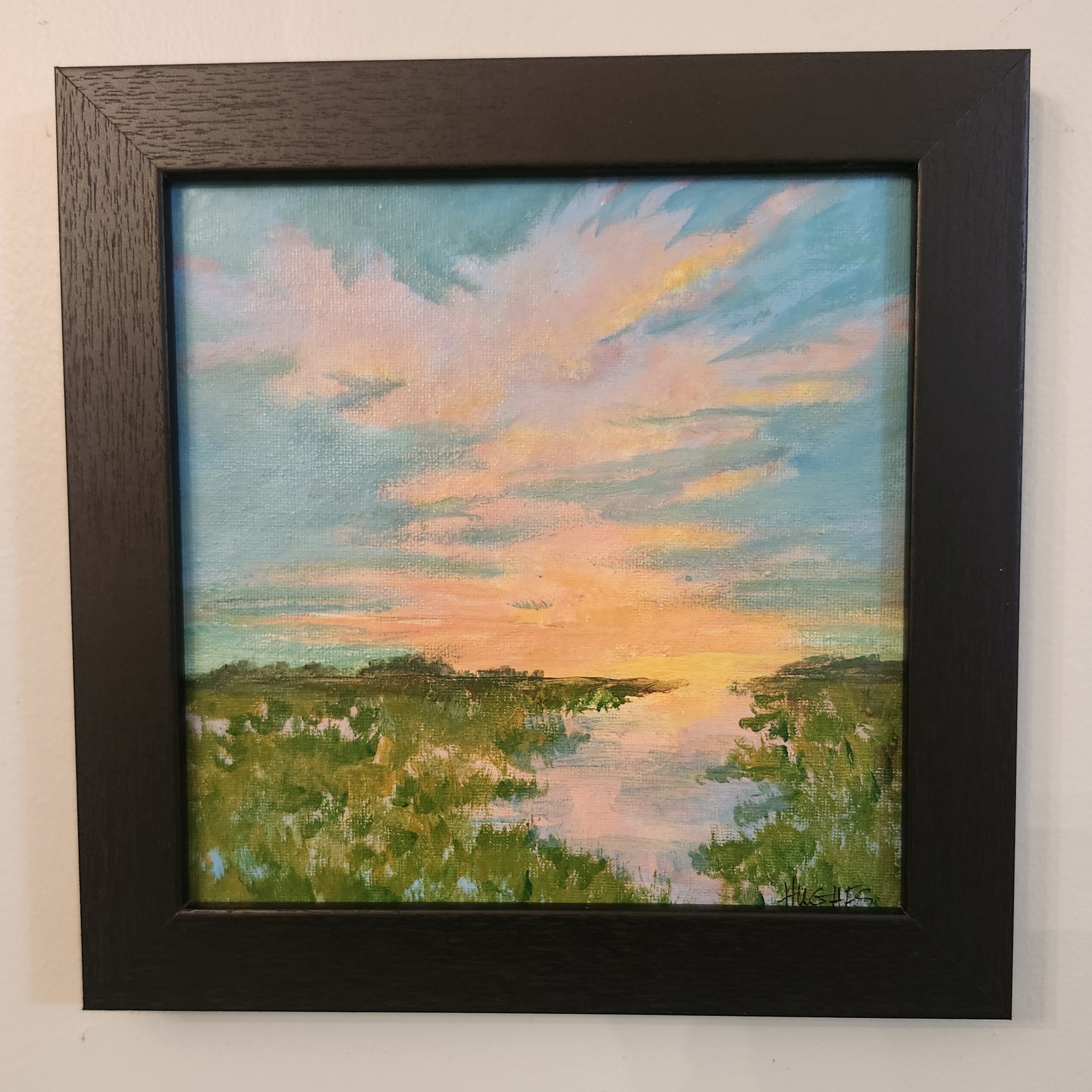 Impressionist painting of a marshland at sunset, soft peach and golden sky meeting muted olive-green grasses with reflective water.